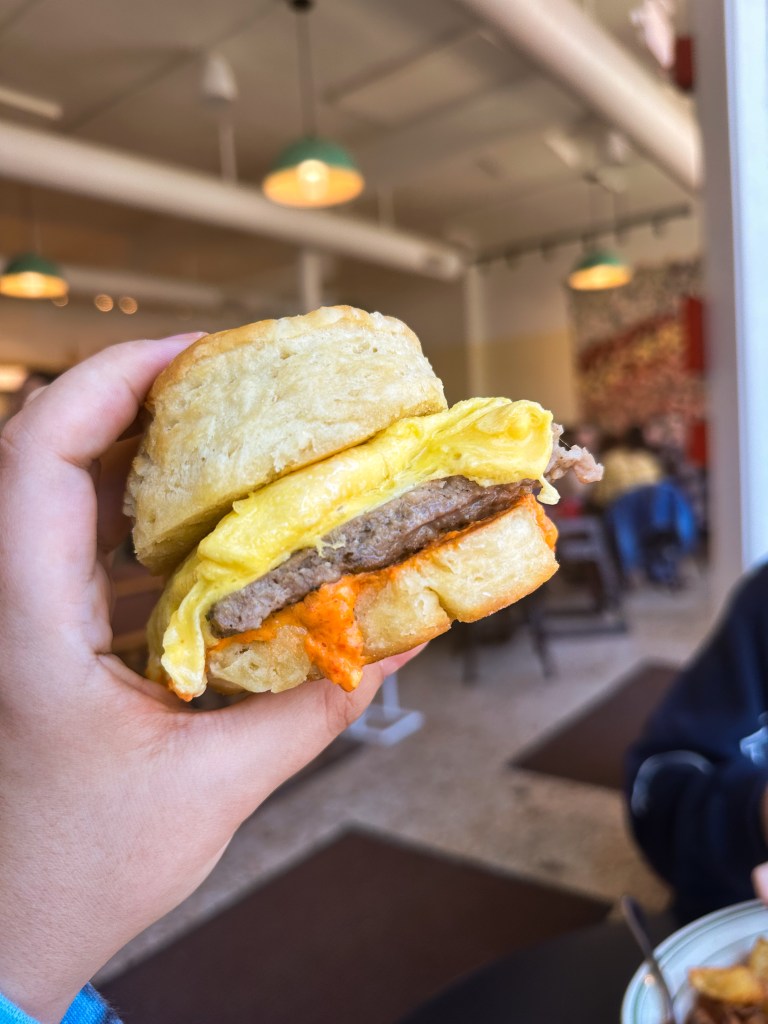 biscuit sandwich with pork sausage, pimento cheese & scrambled eggs